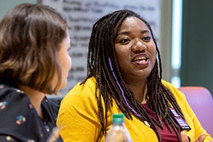 Drs. Yury Parra and Kari-Claudia Allen participates in a discussion during a Society of Teachers of Family Medicine Foundation-funded workshop for underrepresented minority faculty in medicine. Photo by Rhett Butler