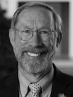 Bearded man with glasses smiling